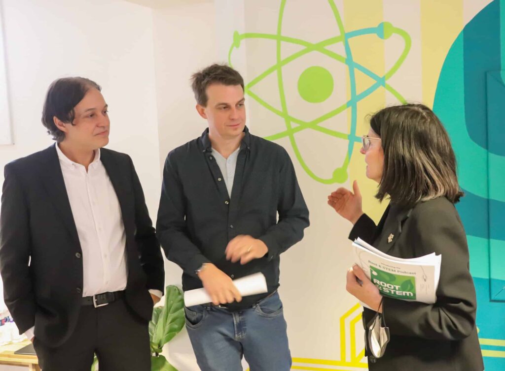 fed-dev-press-release and board member talking with someone from the government of canada.|Government of Canada mic stand in the Lindsay Makerspace.