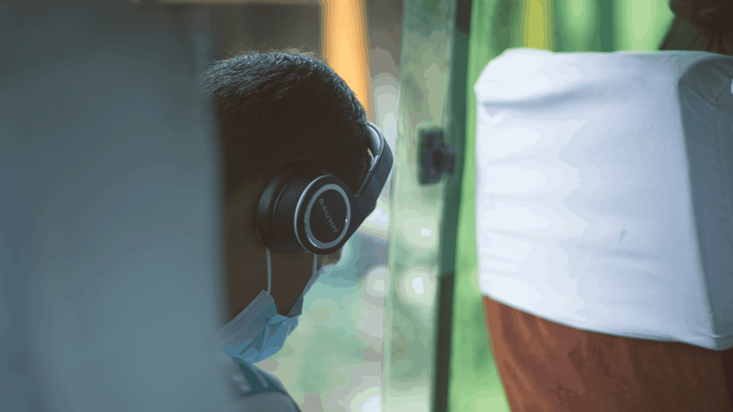 Person wearing mask on public transit
