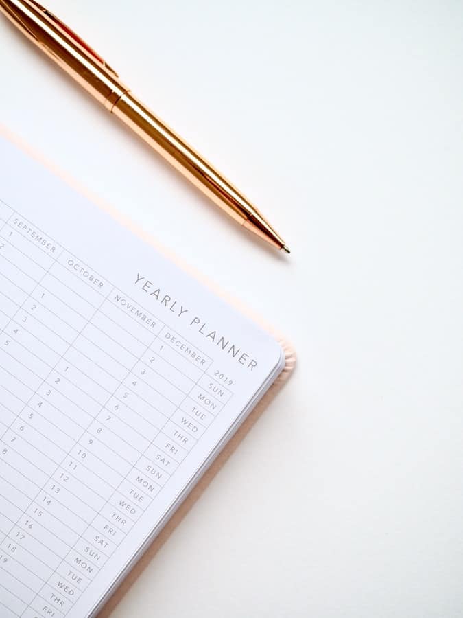 yearly planner in middle of white table