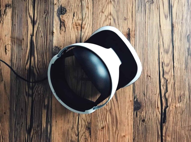 VR headset sitting in the middle of a wooden floor