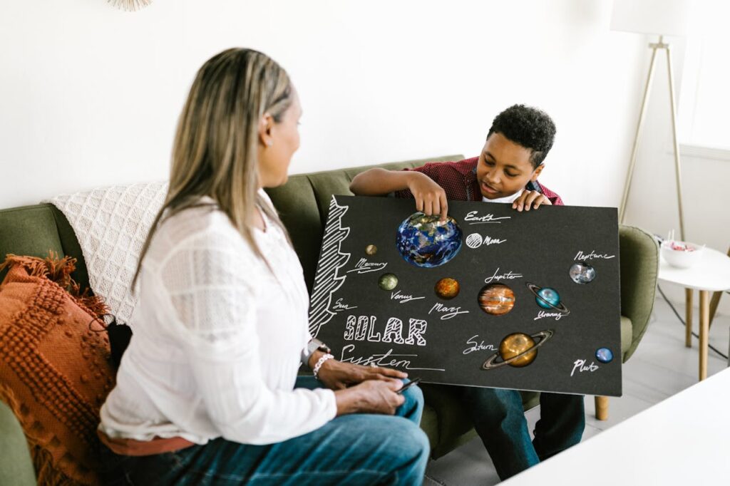 Mother and son working on a solar system project. Engaging family time indoors.